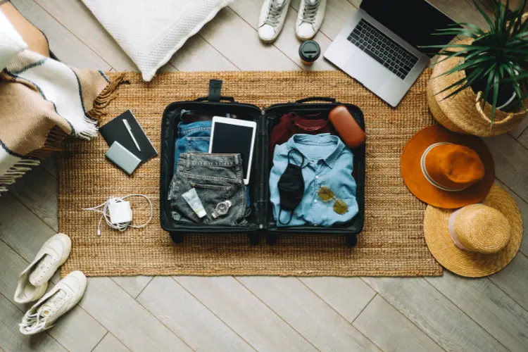 image of suit case being packed