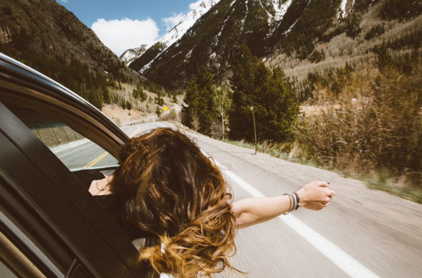 girl-enjoying-road-trip